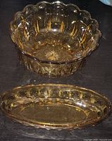 Round and oval amber glass bowls showing shape, color and scalloped edges