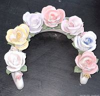 Front view of porcelain arch with pastel roses