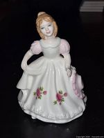 Front view of Royal Doulton November figurine