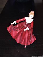 Front view of Samantha figurine in red dress