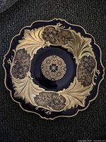 Top view of cobalt and gold gilt platter showing pattern and scalloped edge