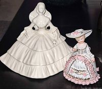 Front view showing both porcelain lady figurines