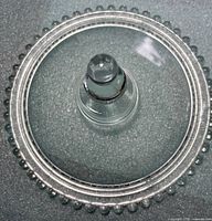 Top view showing entire lid, beaded rim and finial