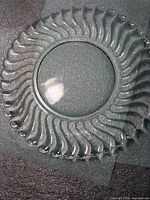 Overhead view of one clear glass swirl luncheon plate