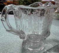 Side view showing Romance etch, applied handle, foot