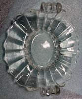 Top view showing oval shape, scalloped rim and handles