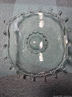 Top view of clear oval bowl showing looped rim and central ridge