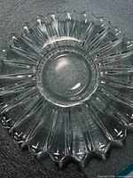 Top view of clear fluted and scalloped glass plate