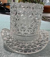 Front view of clear pressed glass top hat toothpick holder