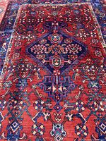 Close view of rug centre showcasing medallion and red field