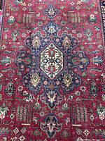 Full view showing central medallion and red field