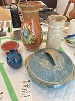 Group shot of vases, casserole with lid, pedestal, bud vase and cup