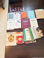 Group view of all sheet music and hymnals laid out on floor