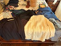 assorted Lands’ End garments spread on bed