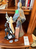 Group shot of all figurines and stones on shelf