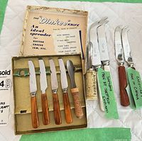 Overall view showing six fruit knives in box and four cheese knives outside
