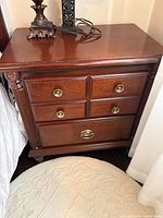 Full view of nightstand between bed and wall