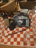 Bottles, cap sets in open box, packaging visible