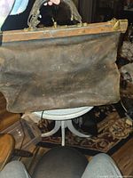 Front view of leather doctor’s bag showing overall form and wear