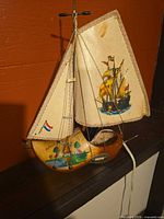 Left side view of wooden clog sailboat lamp unlit