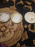 Three floral saucers top view