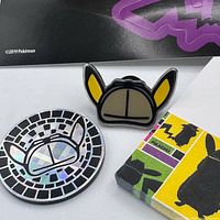 Pin, coin and notepad close-up