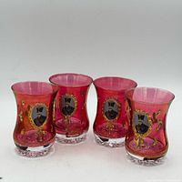 Front view of four ruby cranberry portrait tea cups