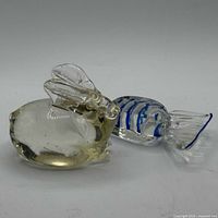 Bunny paperweight and candy figurine side by side