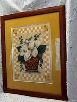 Front view showing stitched design, mat, and wood frame