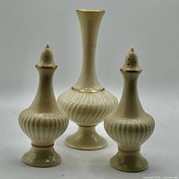 Front view of bud vase centered between salt and pepper shakers