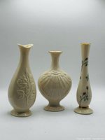 Front view of the three Lenox bud vases