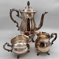 Full view of three-piece silver plate tea service