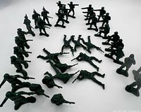 curved formation of green plastic soldiers in various poses