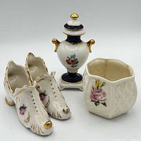 Group view of miniature porcelain planter, urn and pair of shoe vases