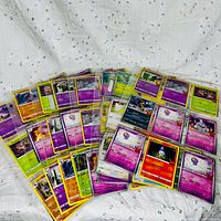 Spread of assorted Pokémon cards showing quantity and variety