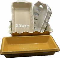 Three nested pans and bread basket showing shapes and colors