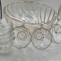 Punch bowl with hanging cups attached