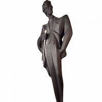 Full front view of matte black male figure sculpture on base