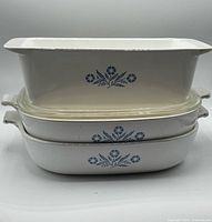 Stacked view of three Blue Cornflower dishes with glass lid