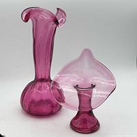 Both cranberry vases side by side