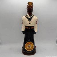 Front view of figural Doorly's rum decanter