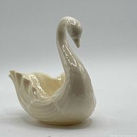Right side profile of Lenox ivory porcelain swan dish