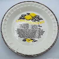 Top view of ceramic pie dish showing recipe graphic and rim design