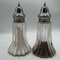 Front view showing crystal bodies and silver-plated caps