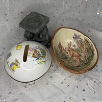 Top view showing mushroom bank slot, rabbit bowl interior art and tealight holder