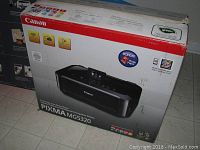 Canon PIXMA MG5320 printer box showing wireless printing capabilities and model details