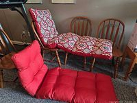 Both cushions showing solid red side and patterned side