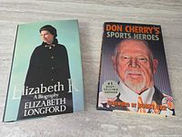 Both hardcover books front covers visible