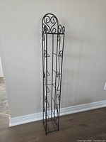 Front view of tall black metal CD rack