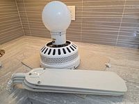 Motor housing with light globe and stacked blades